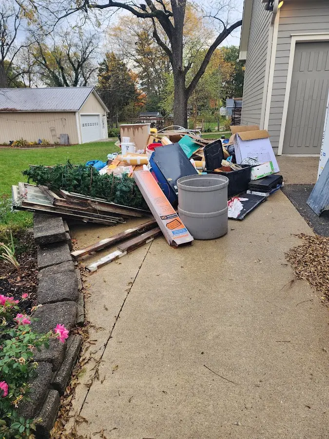 Dumpster being loaded with debris for 3 Yard Dumpster Rental in Nicholasville